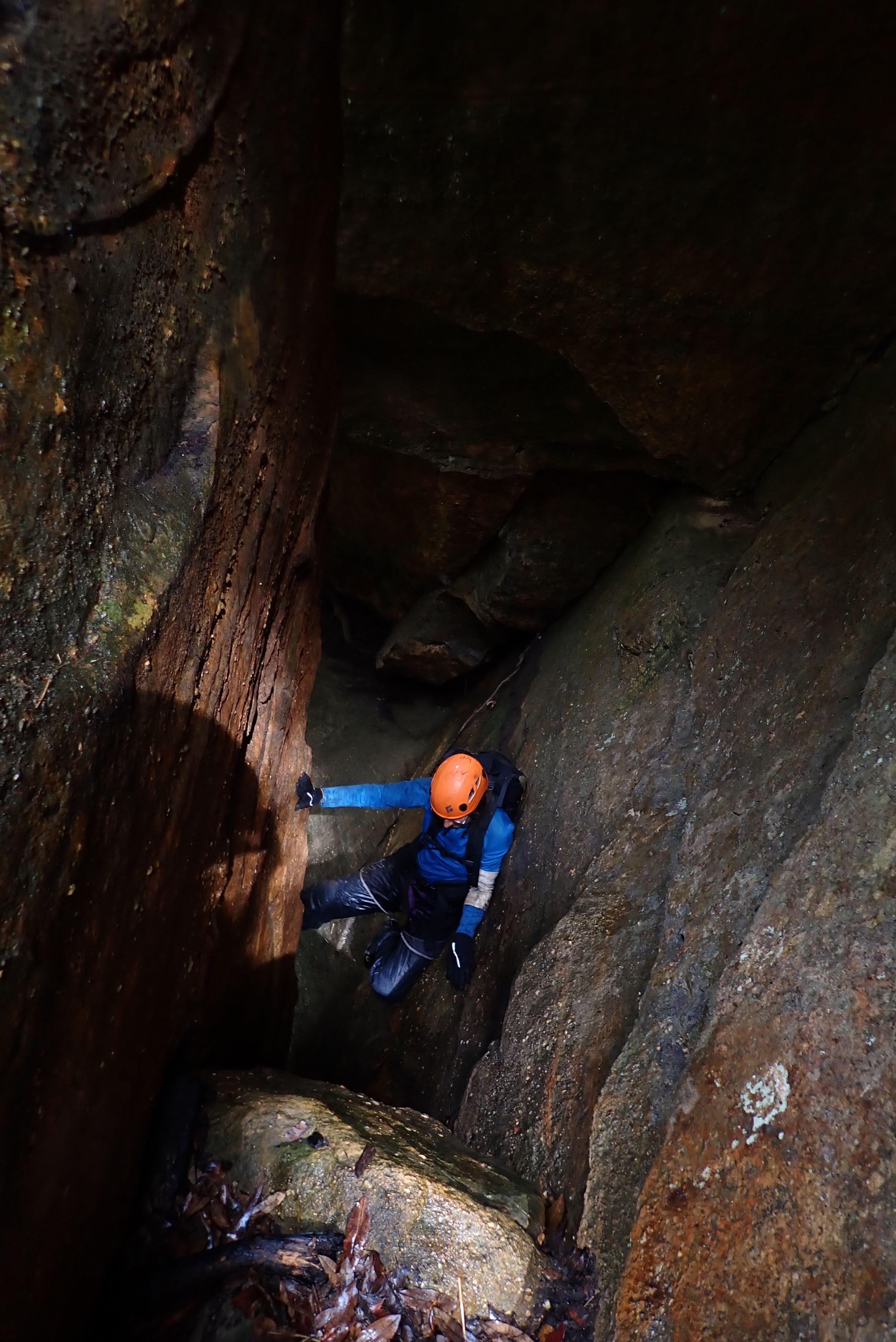 Chimneying up a crack to avoid the waterfall.